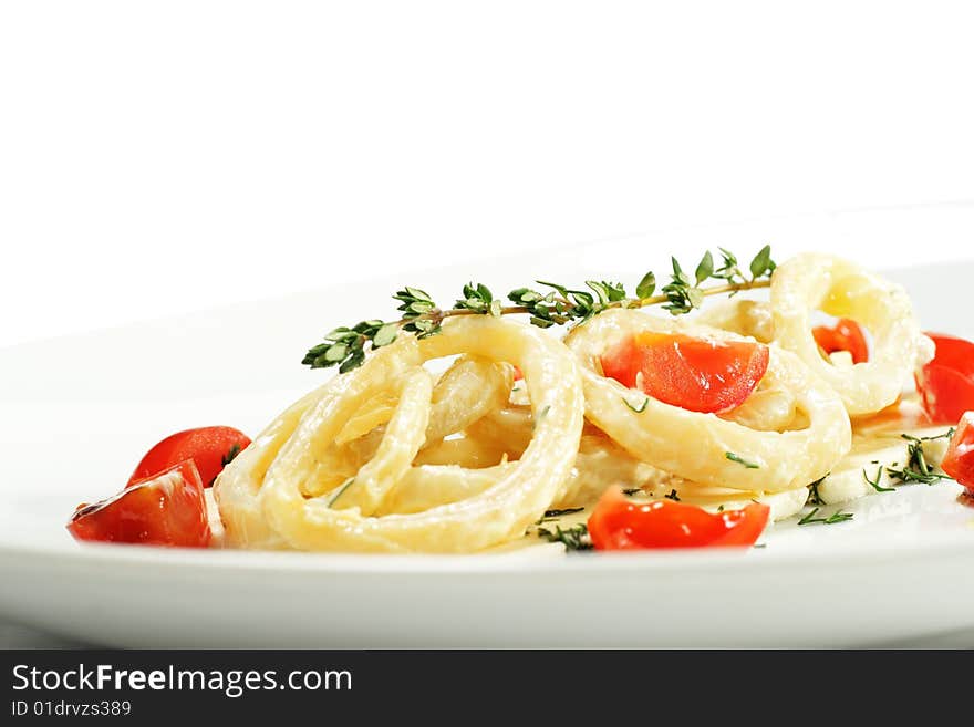 Salad with Calamari Rings, Sheep Cheese and Tomato. Isolated on White Background. Salad with Calamari Rings, Sheep Cheese and Tomato. Isolated on White Background