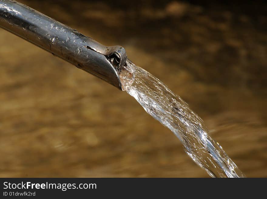 Water coming out of a tube. Water coming out of a tube.