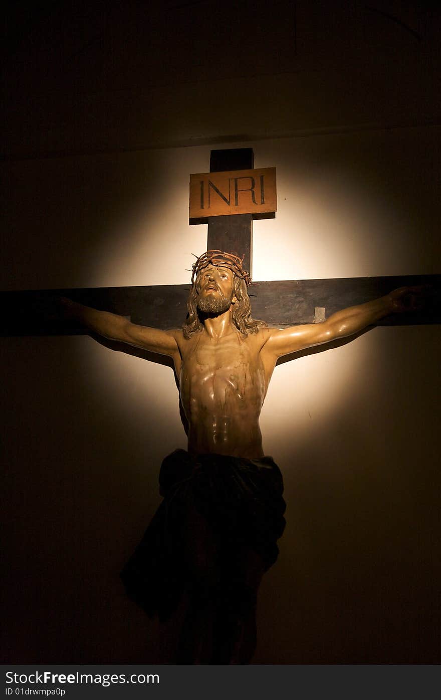 Illuminated christ inside church of segovia spain