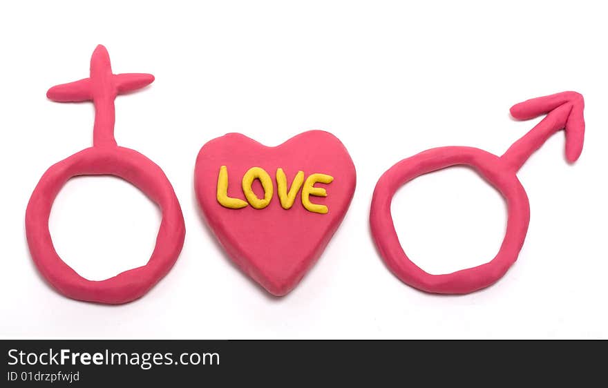 Heart made with plasticine with word love on it and male and female signs isolated on white. Heart made with plasticine with word love on it and male and female signs isolated on white