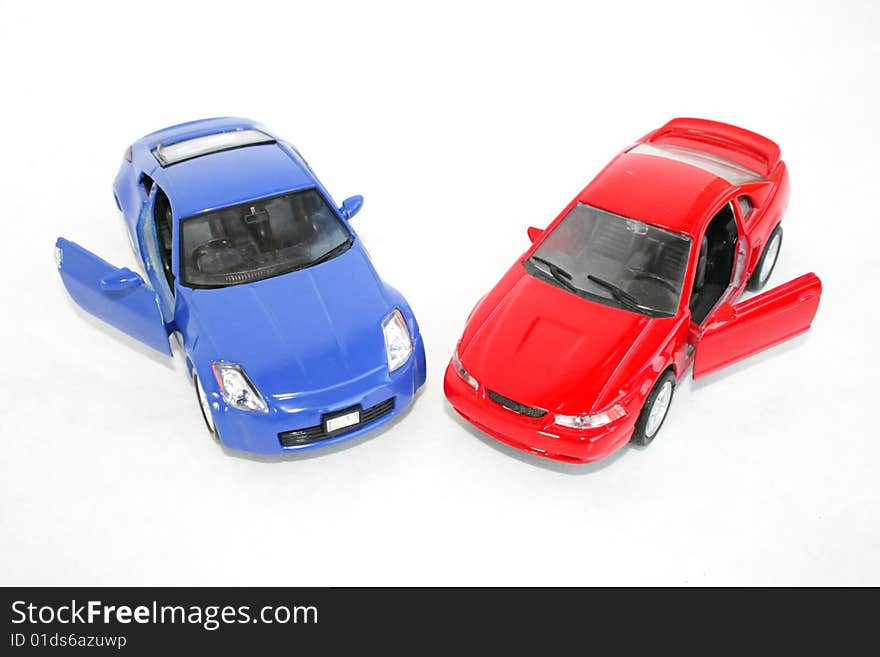 The two toy red and blue machine on a white background. The two toy red and blue machine on a white background