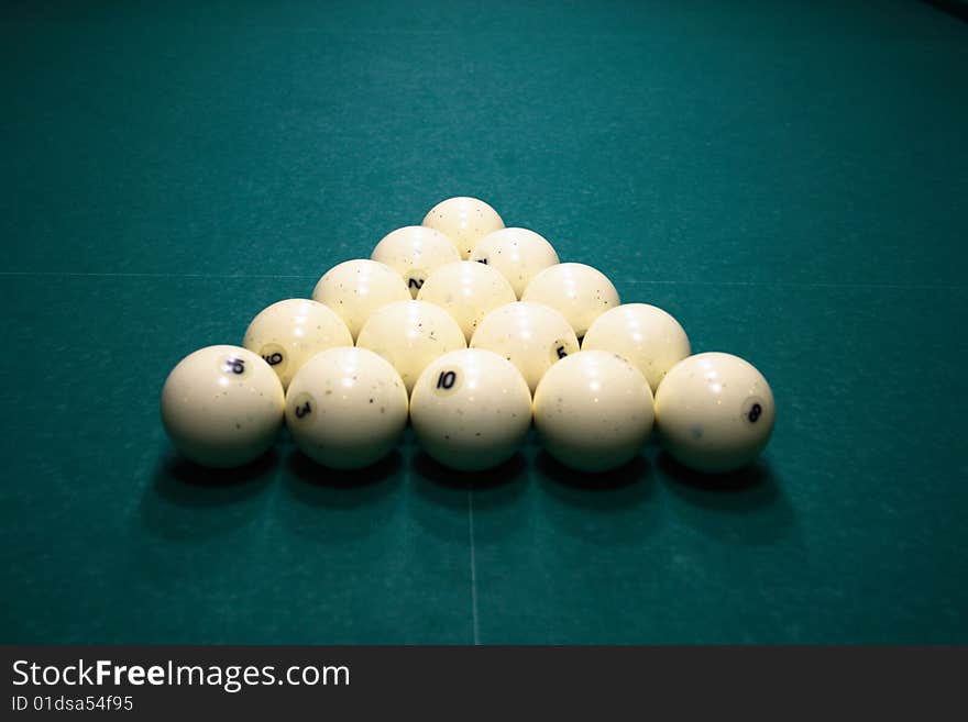 Pool balls on green pool table