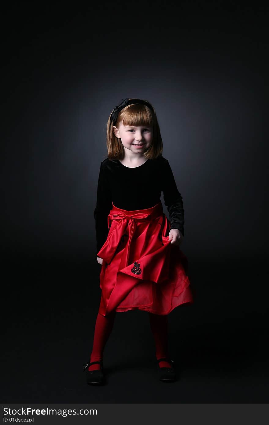 Pretty Young Girl In Red Dress Spinning