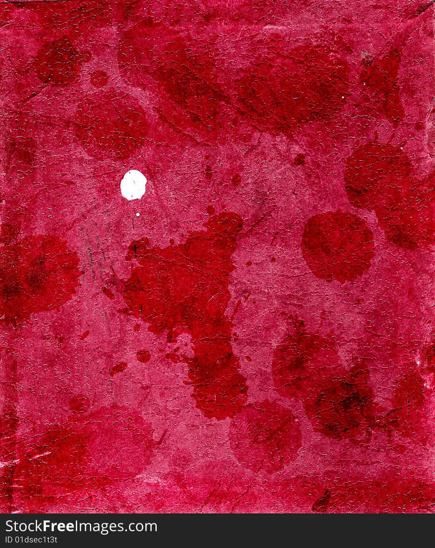 Cardboard in spots of a red paint