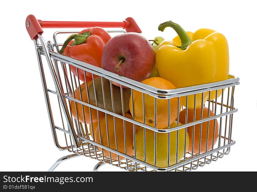 Shopping trolley with fruits and vegetables against a white background