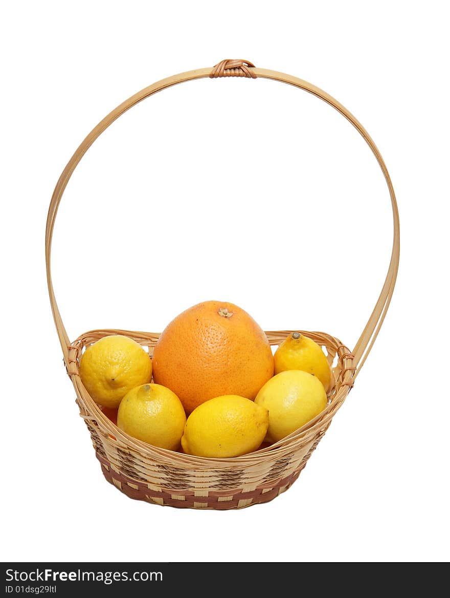 Basket wth grapefruit and lemons isolated on a white background .