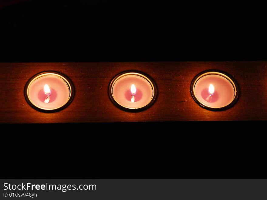 Candles row in a winter frozen night. Candles row in a winter frozen night.