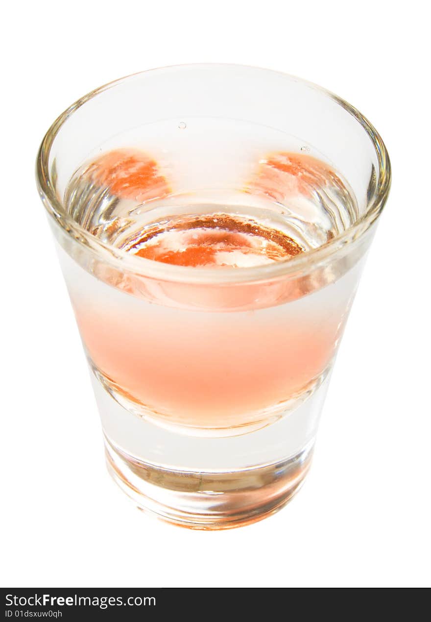 Orange alcohol drink shot from top, isolated