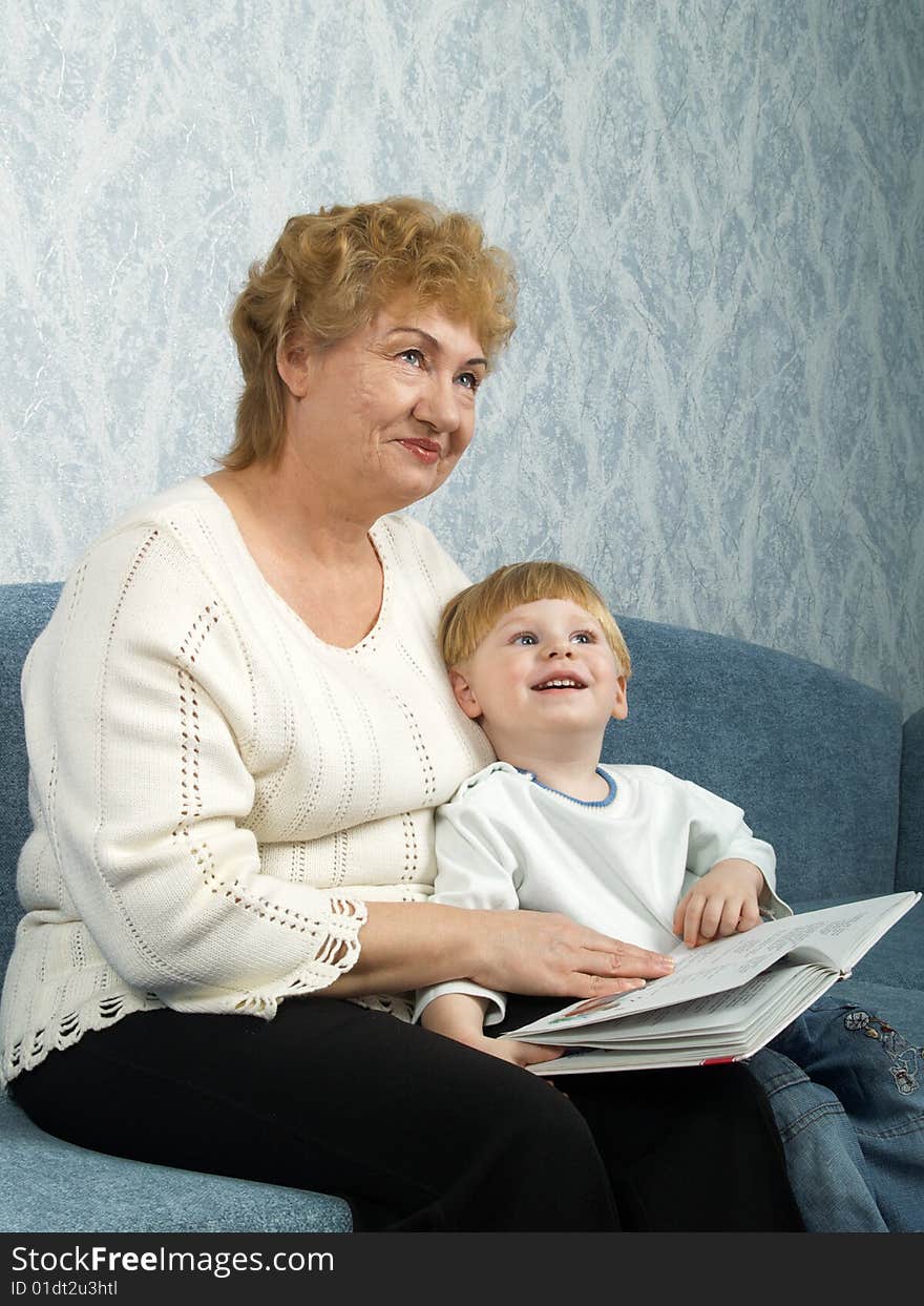 Portrait of the grandmother with the grandson in house conditions