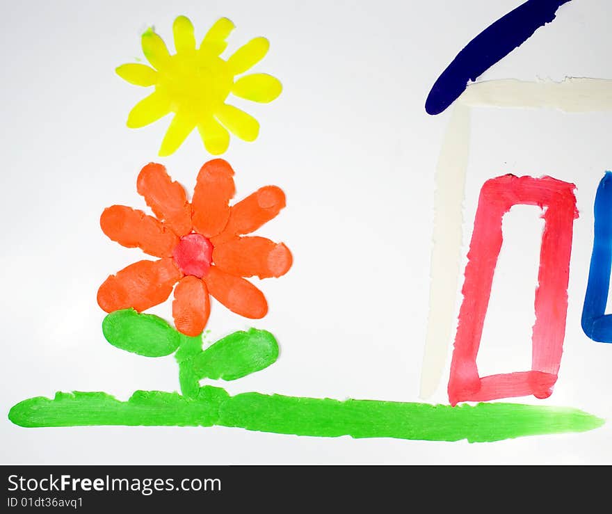 Installation from plasticine of the house with a flower on green and sun