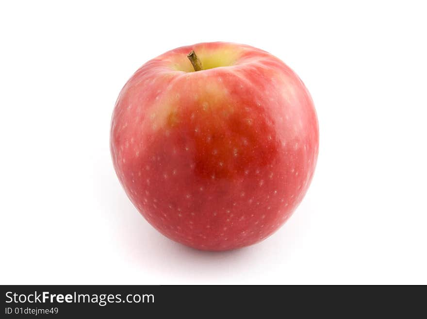 A single fresh, crisp red apple isolated on a white background