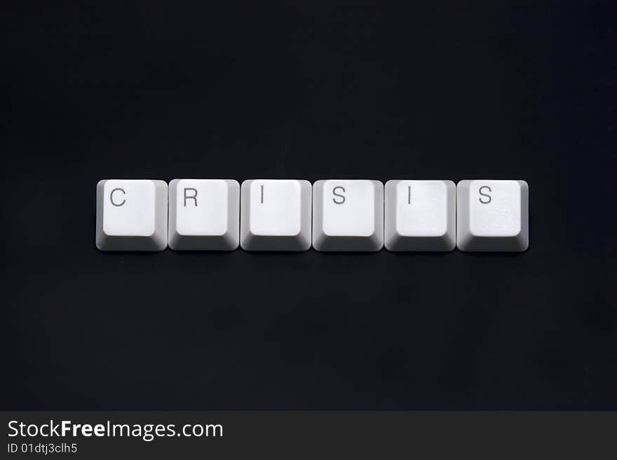 Crisis sign made of keyboard keys isolated on black background. Crisis sign made of keyboard keys isolated on black background