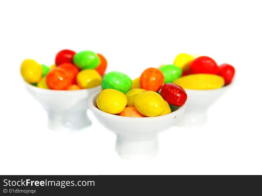 An image of multicolored candies over white