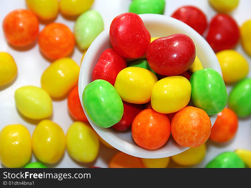 An image of multicolored candies over white