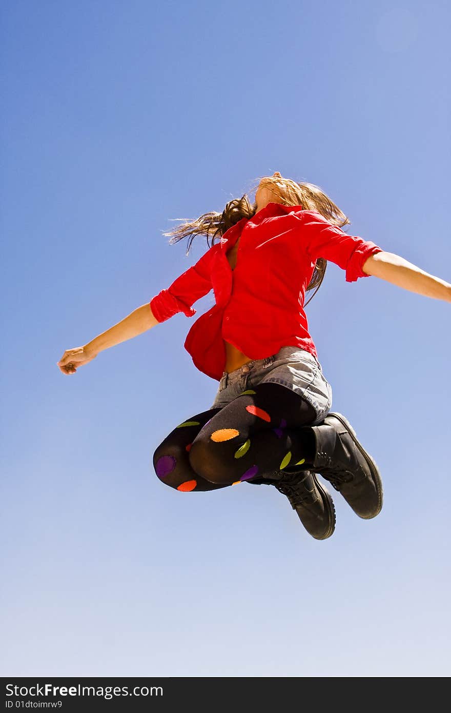 Jumping woman in funny casual clothing. Jumping woman in funny casual clothing