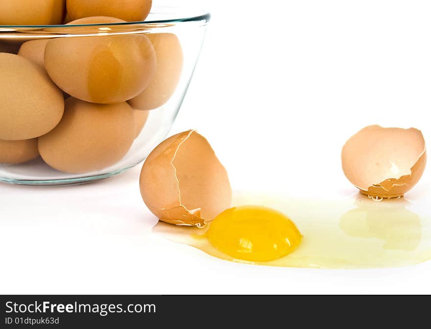 Cracked egg closeup on a white background. Cracked egg closeup on a white background