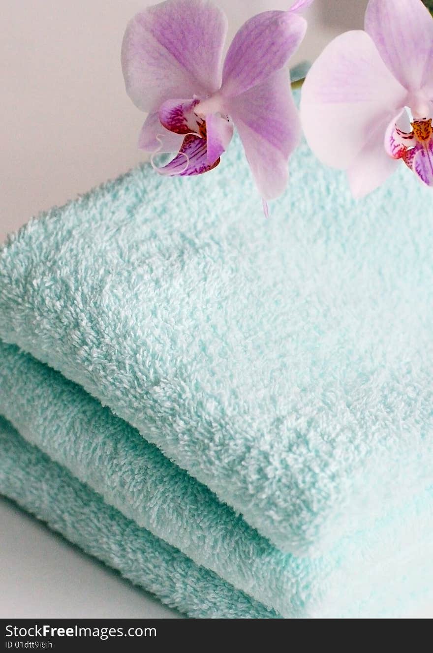 Tender towels with an orchid in close up