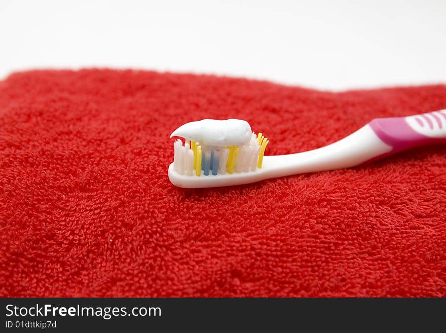 Toothbrush on a red towel