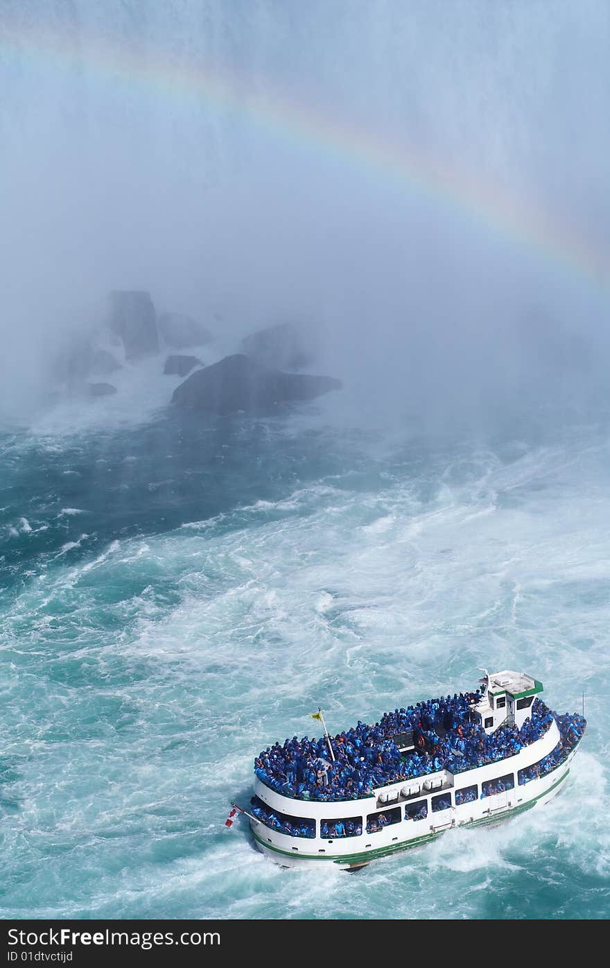 Ship near Niagara Fall with rainbow at the background