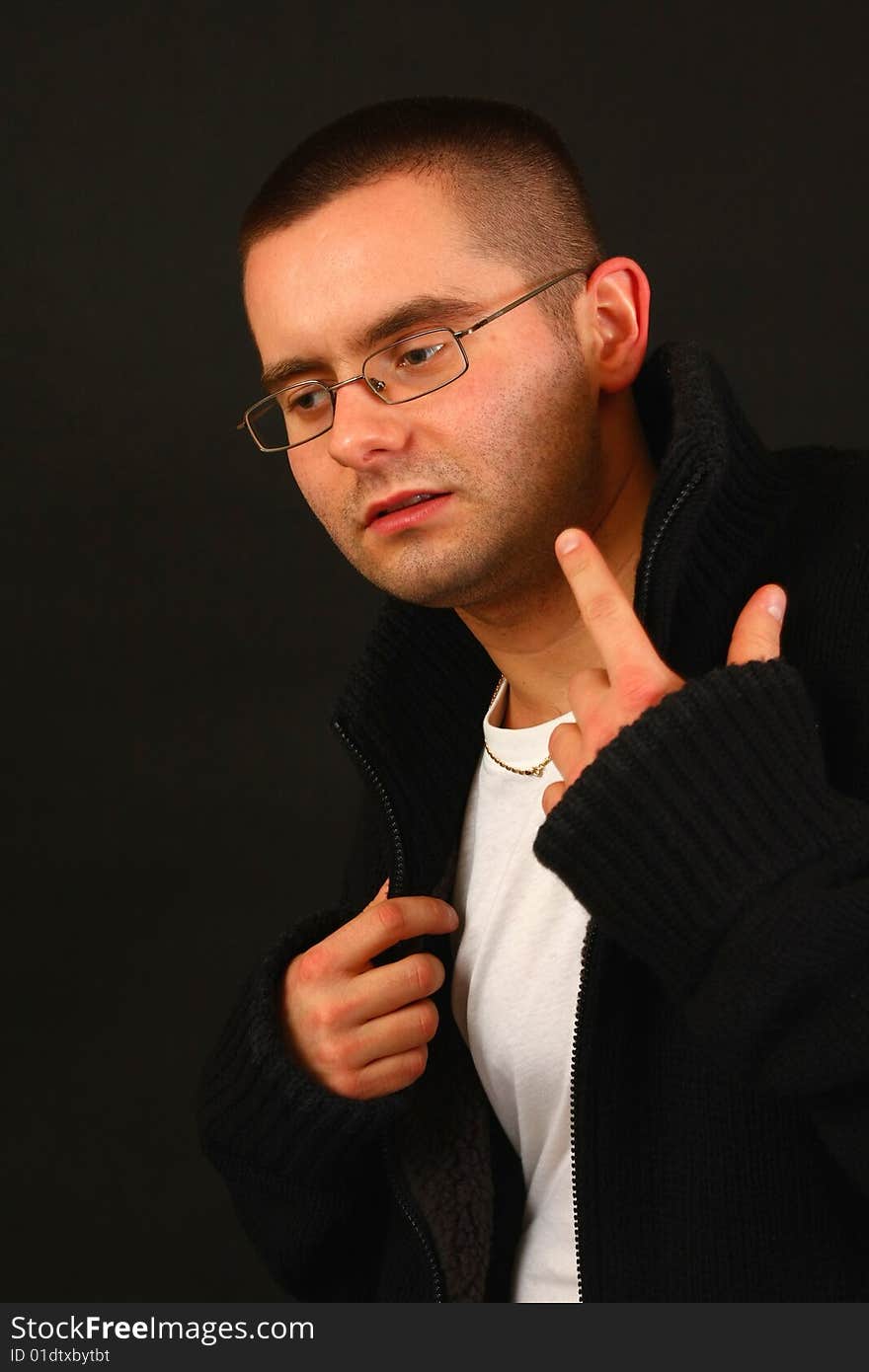 Young relaxed casual man pointing with his finger