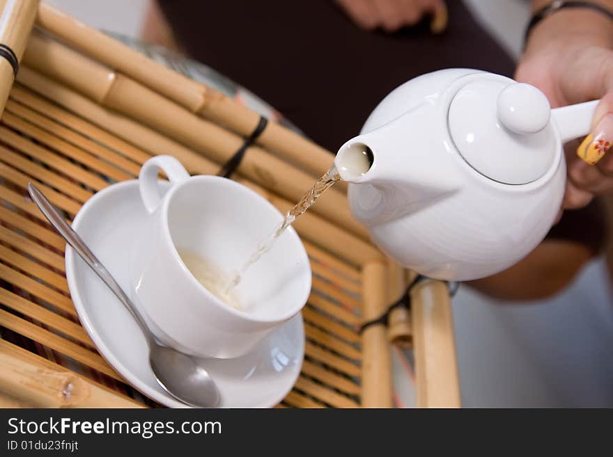 Closeup picture of tea ceremony set in action. Closeup picture of tea ceremony set in action