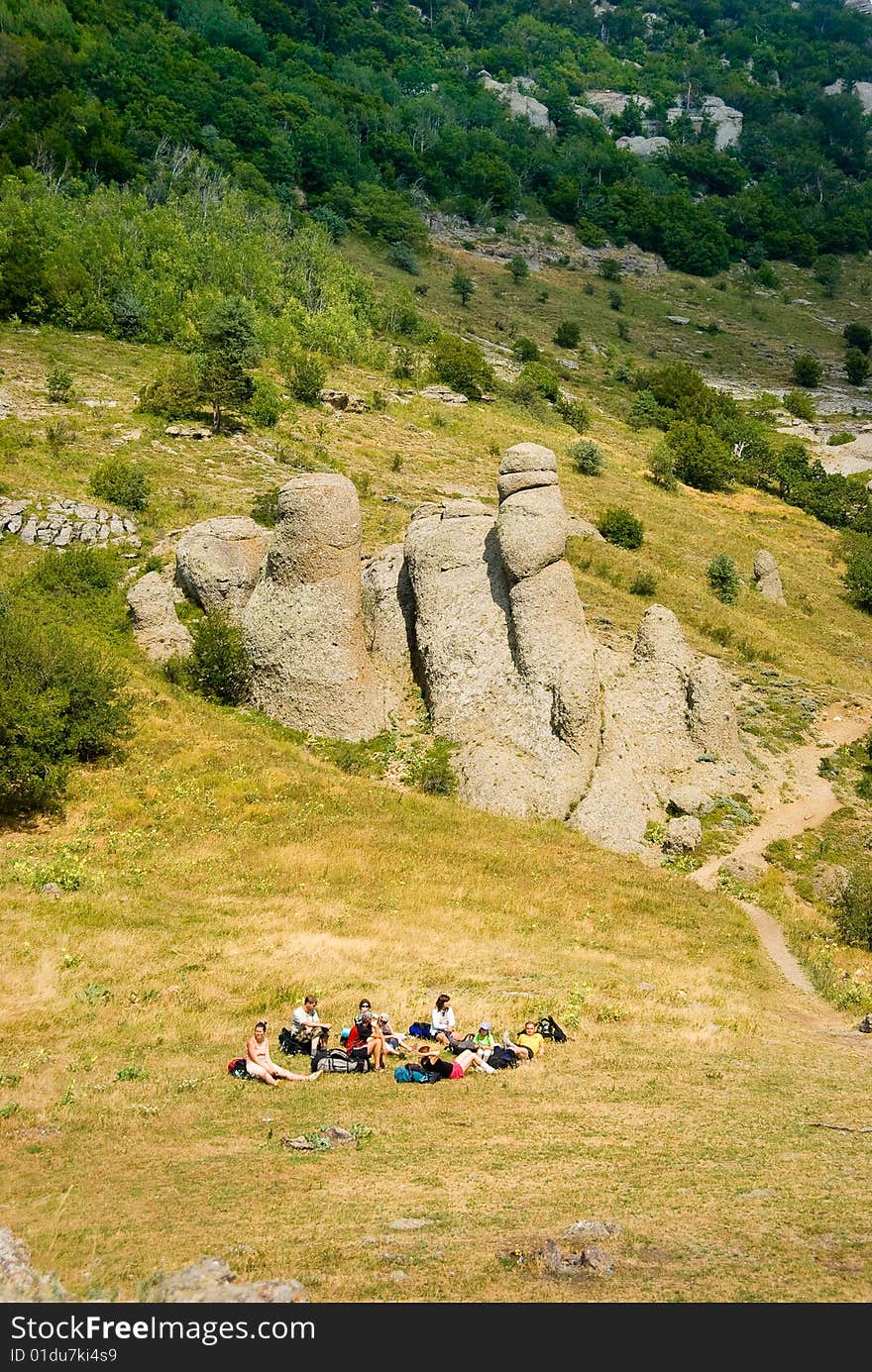 Hikers have a rest on a hillside