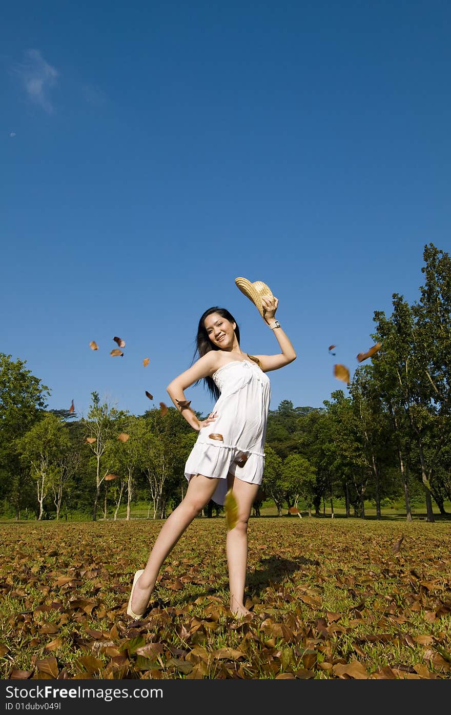 A beautiful asian girl enjoying the outdoor sun. A beautiful asian girl enjoying the outdoor sun