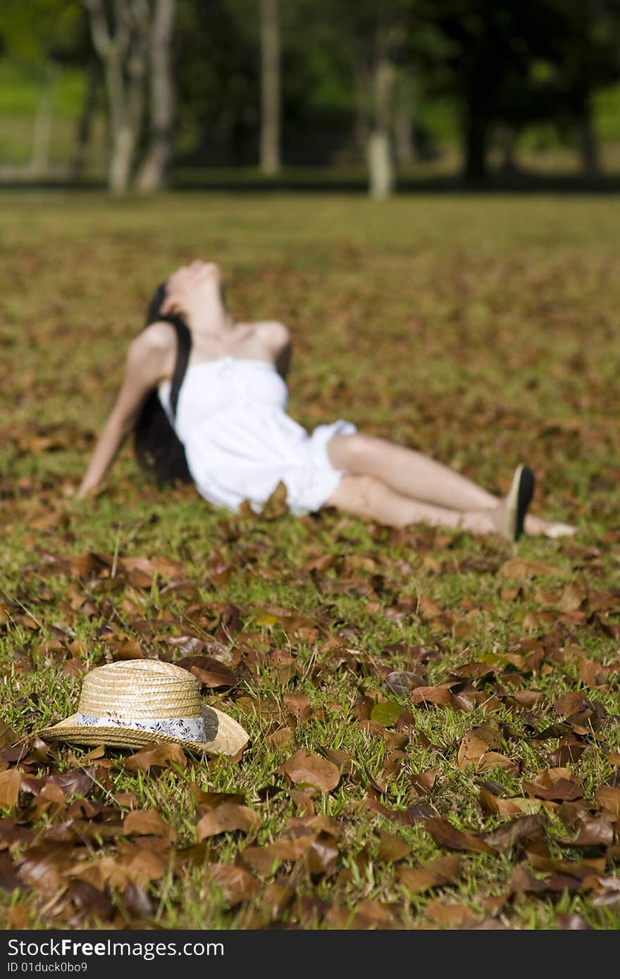 A beautiful asian girl enjoying the outdoor sun. A beautiful asian girl enjoying the outdoor sun