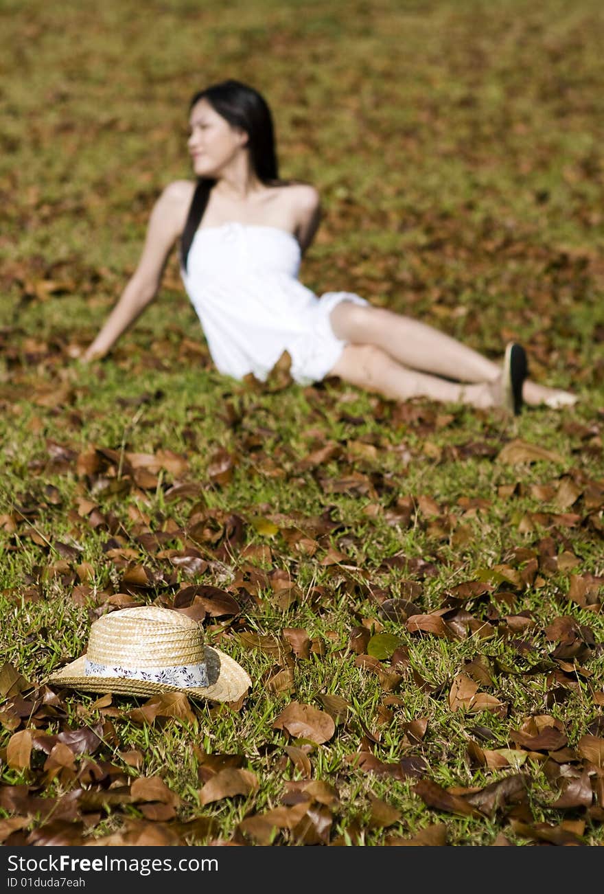 A beautiful asian girl enjoying the outdoor sun. A beautiful asian girl enjoying the outdoor sun