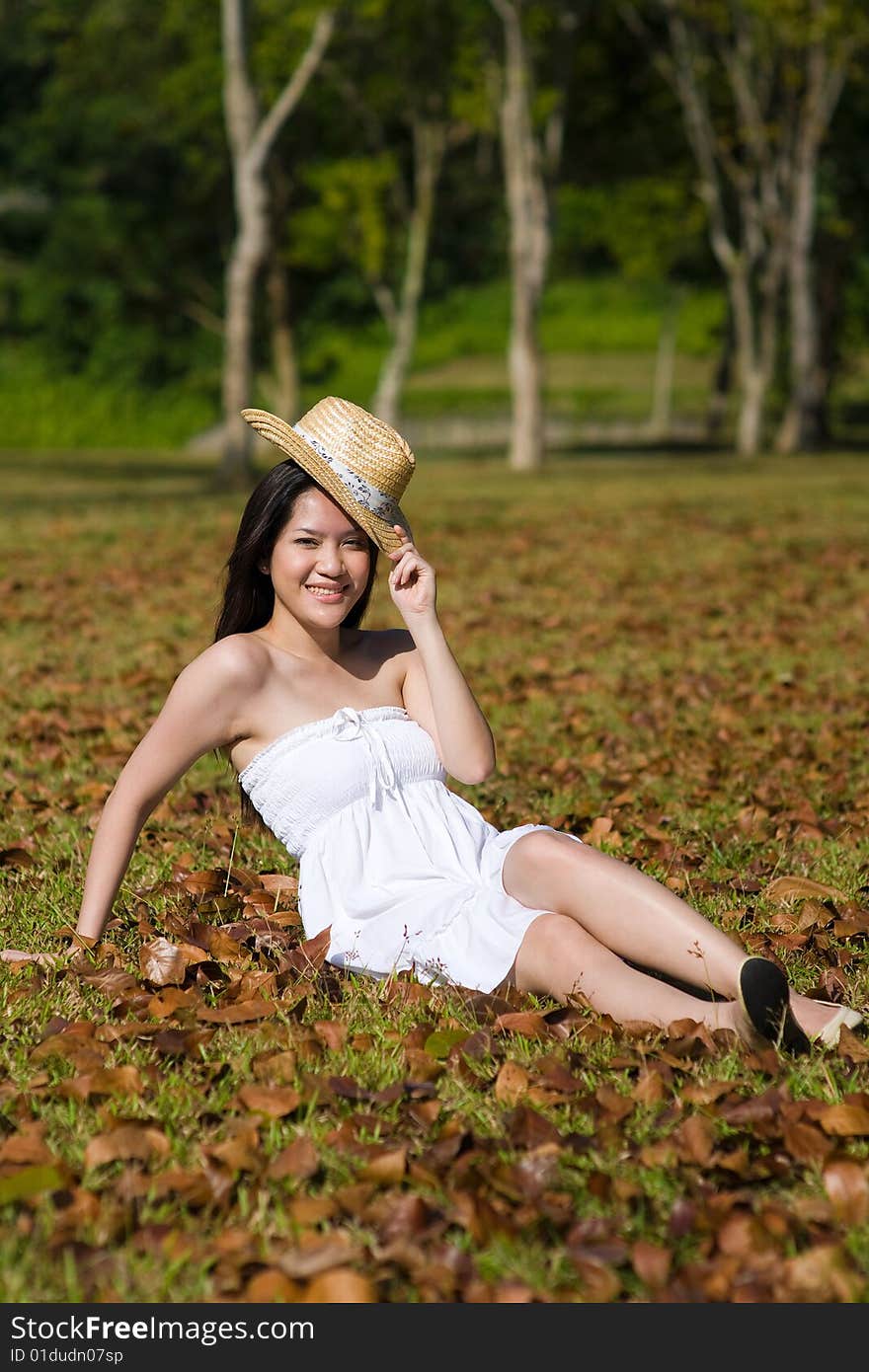 A beautiful asian girl enjoying the outdoor sun. A beautiful asian girl enjoying the outdoor sun