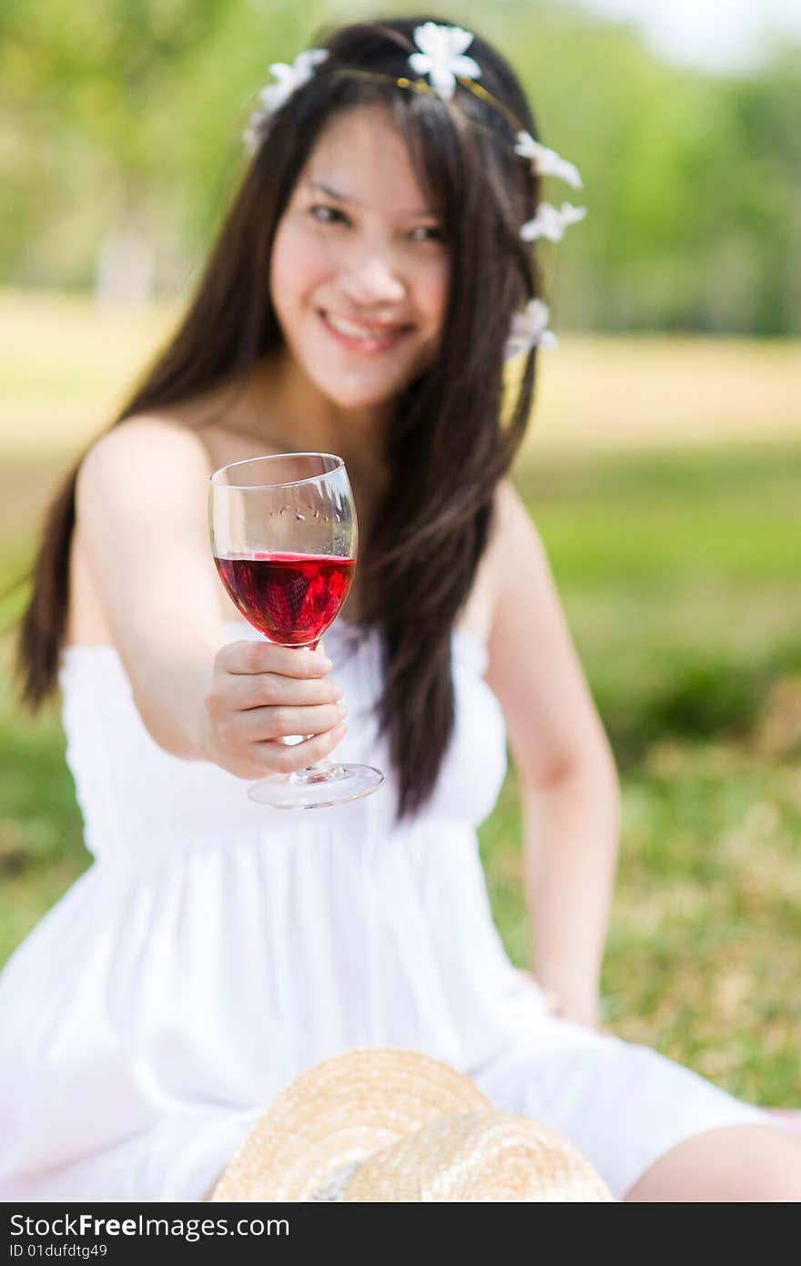 A beautiful asian girl enjoying the outdoor sun. A beautiful asian girl enjoying the outdoor sun