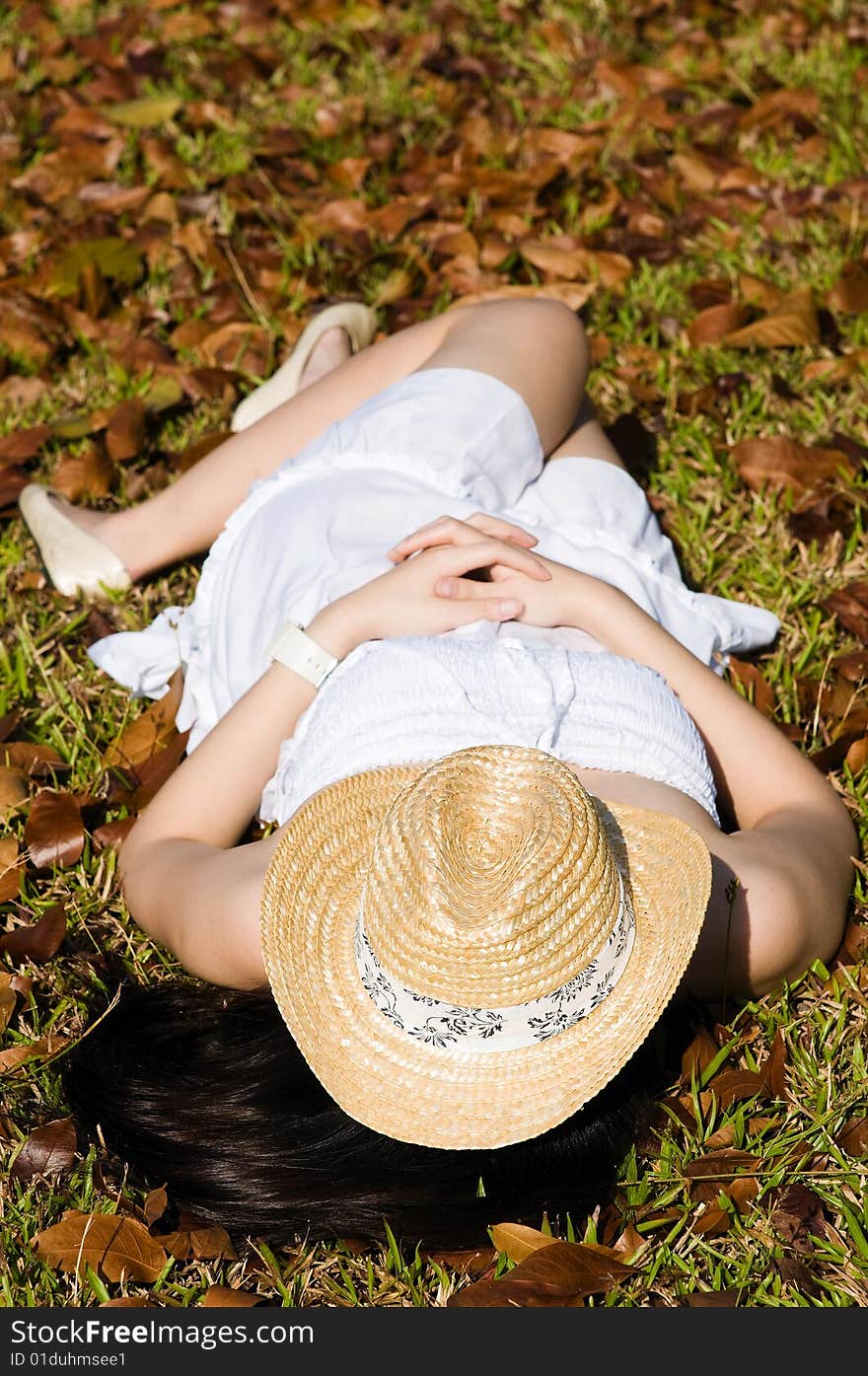 A beautiful asian girl enjoying the outdoor sun. A beautiful asian girl enjoying the outdoor sun