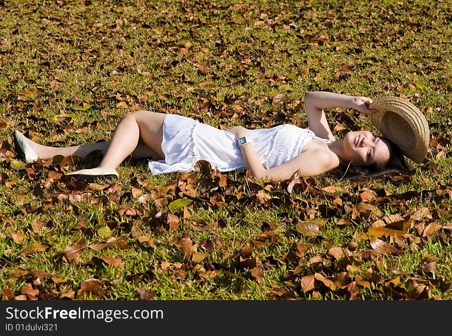 A beautiful asian girl enjoying the outdoor sun. A beautiful asian girl enjoying the outdoor sun