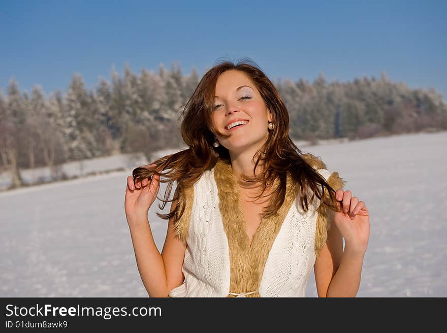 Sexy brunette woman in winter outfit