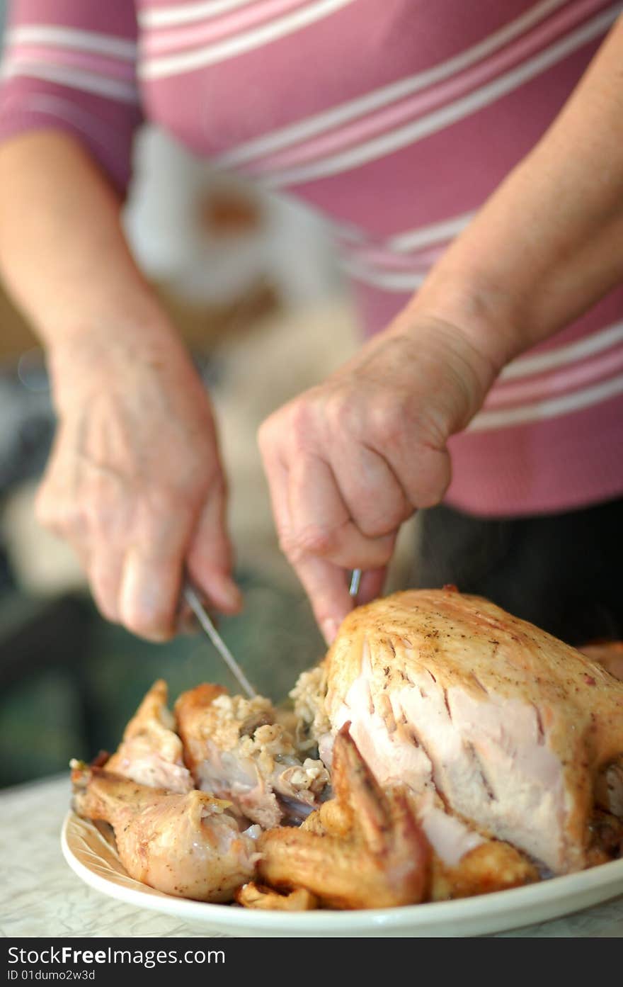 Woman Parts Fried Chicken At Kitchen