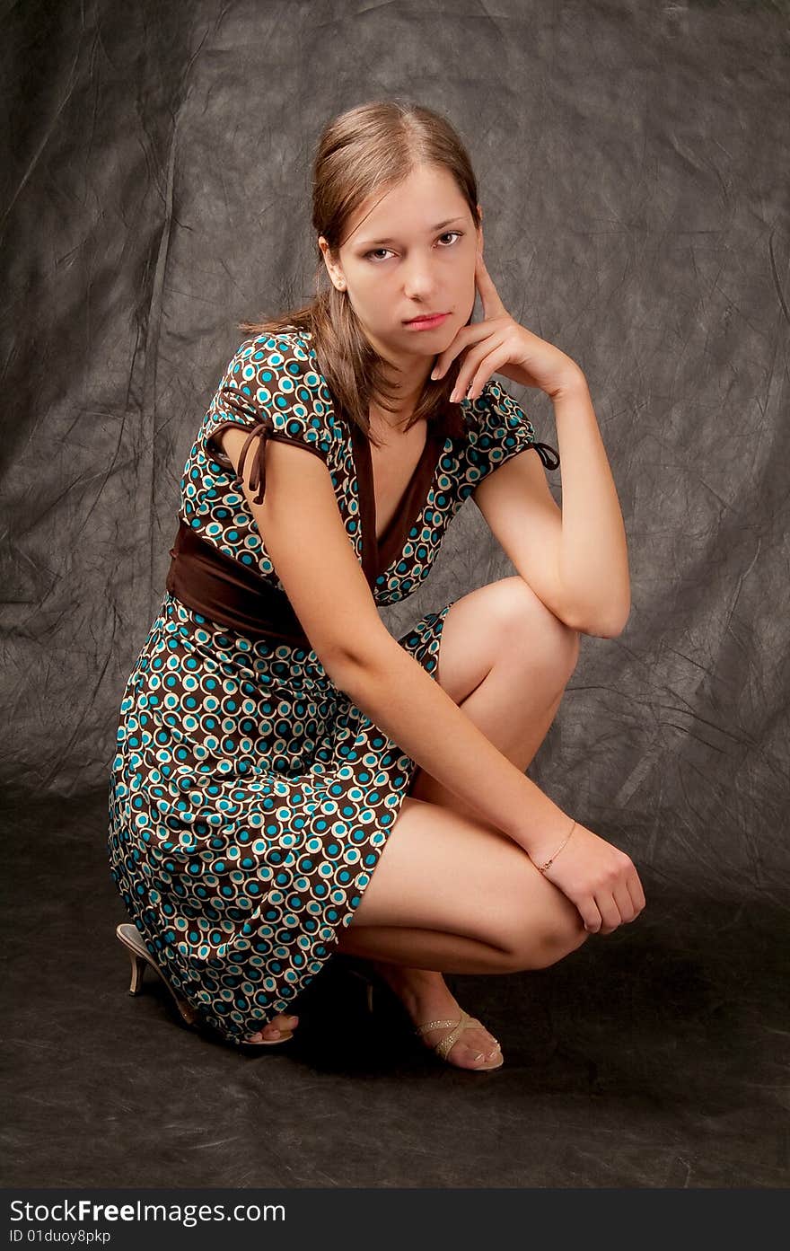 Young girl white skin sitting on black