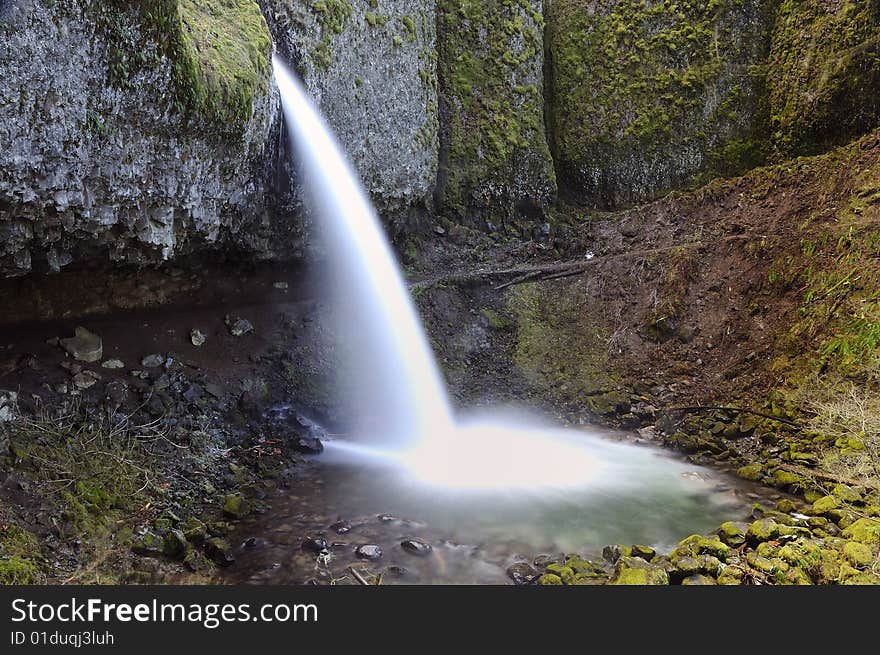 Upper horsetail also known as ponytail falls in a remote high altitude area of columbia river gorge. Upper horsetail also known as ponytail falls in a remote high altitude area of columbia river gorge