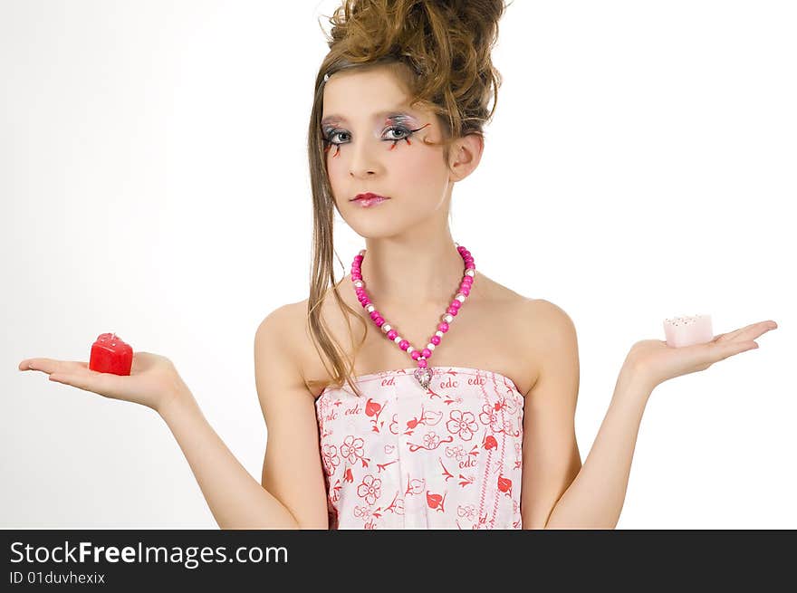 Fashion girl holding valentine's day candles in her hands. Fashion girl holding valentine's day candles in her hands