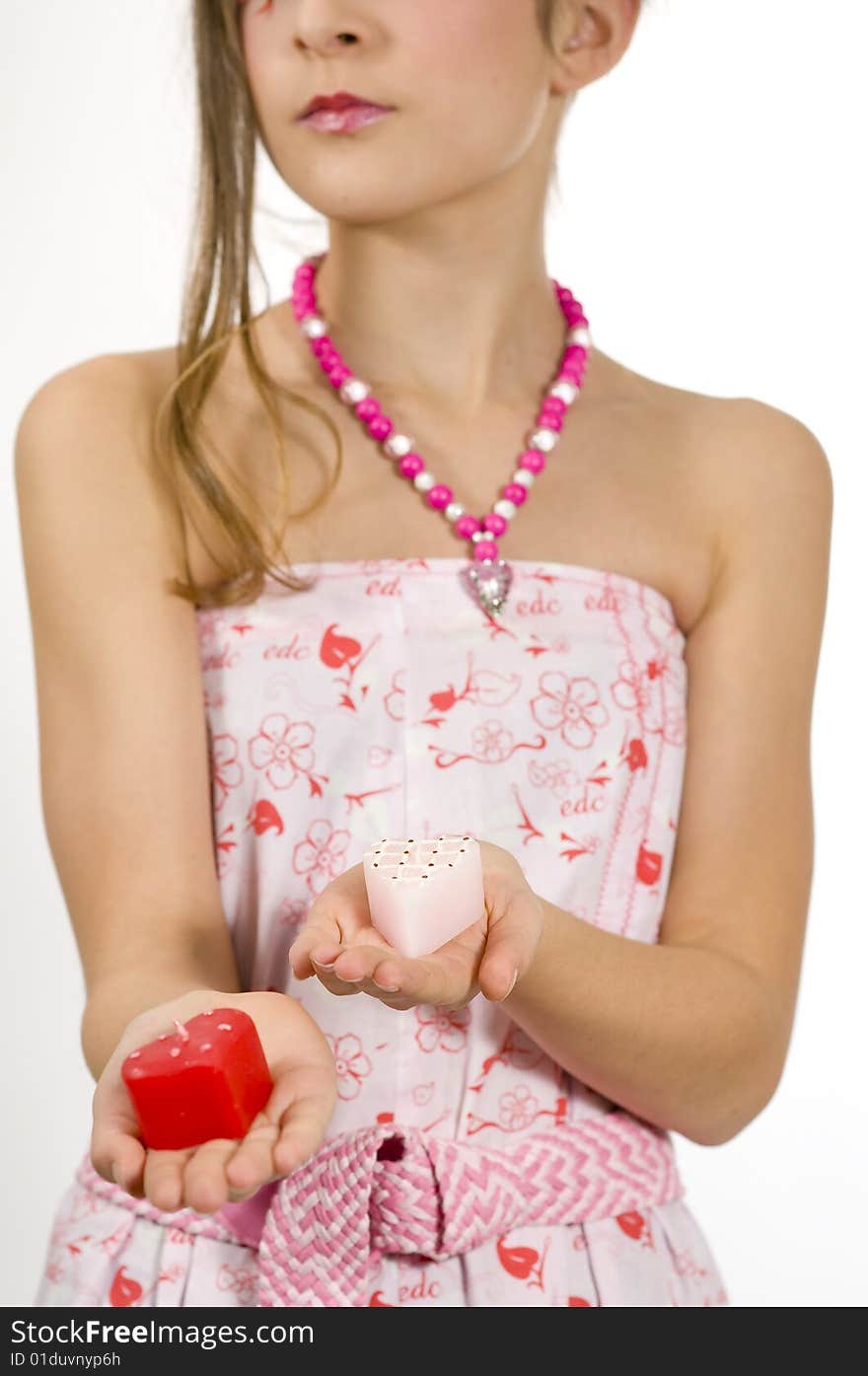 Fashion girl holding valentine's day candles in her hands. Fashion girl holding valentine's day candles in her hands