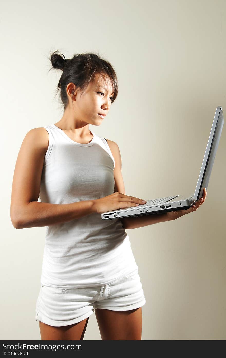 Woman Holding a Laptop