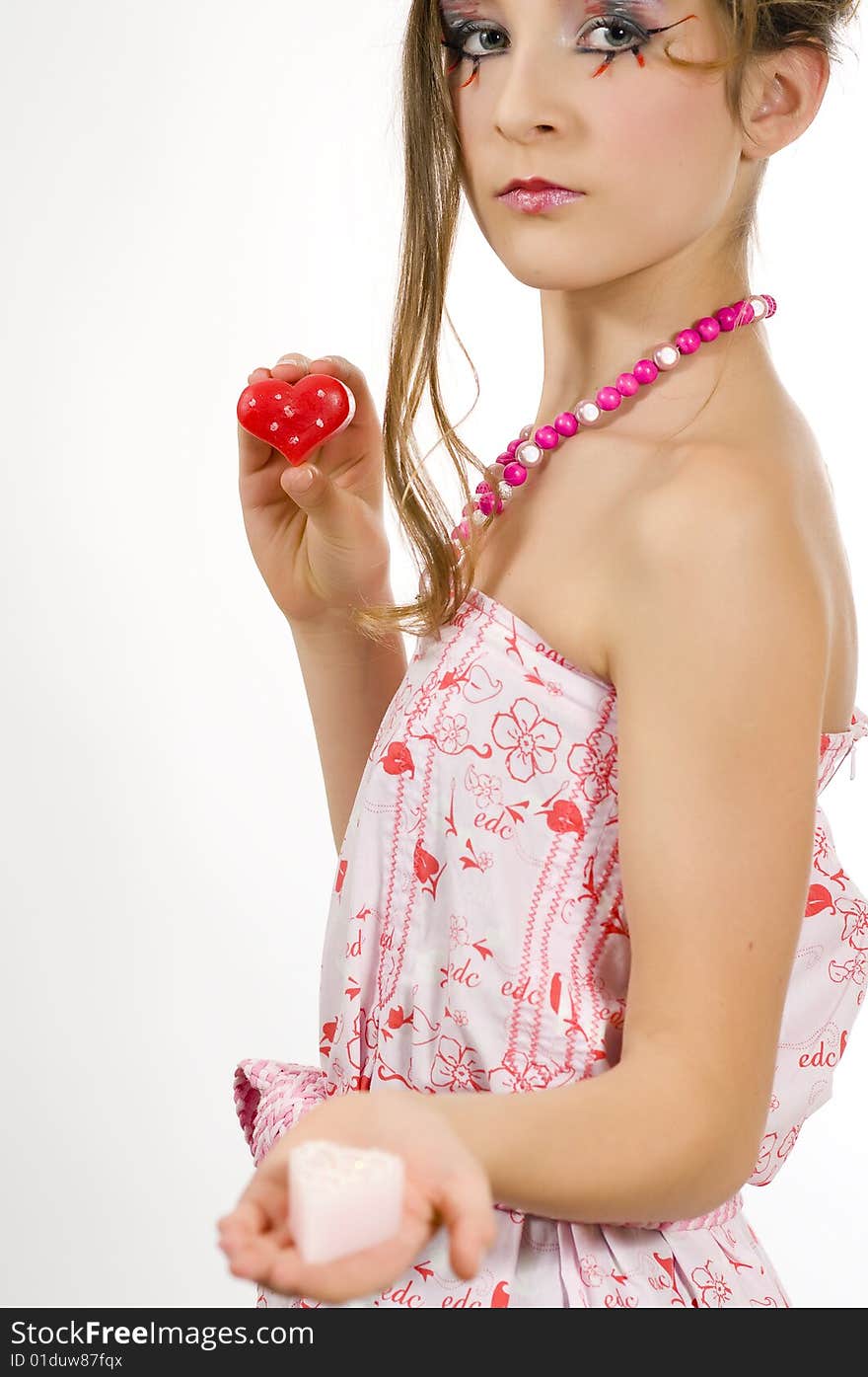 Fashion girl holding valentine's day candles in her hands. Fashion girl holding valentine's day candles in her hands