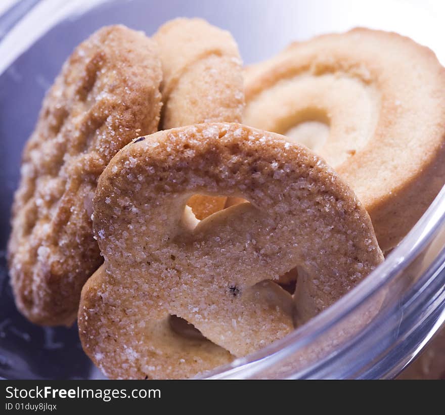 Danish traditional homemade cookies in a glass bowl, close up. Danish traditional homemade cookies in a glass bowl, close up