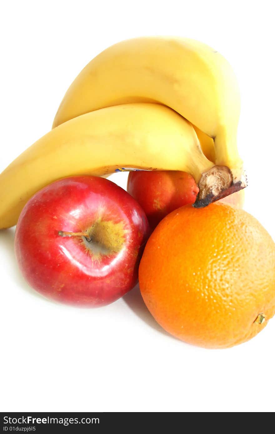 Banana apple and orange isolated against white. Banana apple and orange isolated against white.