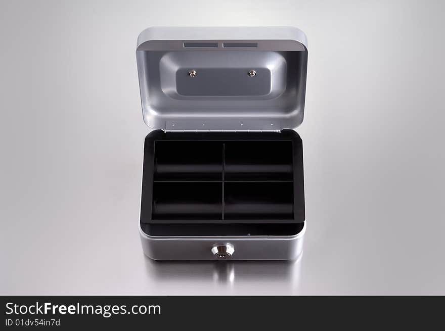 Opend cash box on metalic background. Opend cash box on metalic background