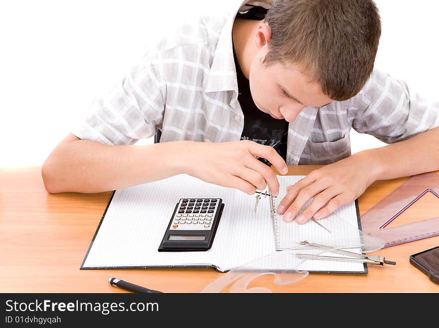 Casual teen learning at desk. Casual teen learning at desk