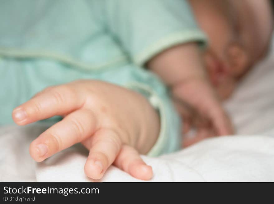 Fingers of the sleeping baby. Note: Slight blurriness.