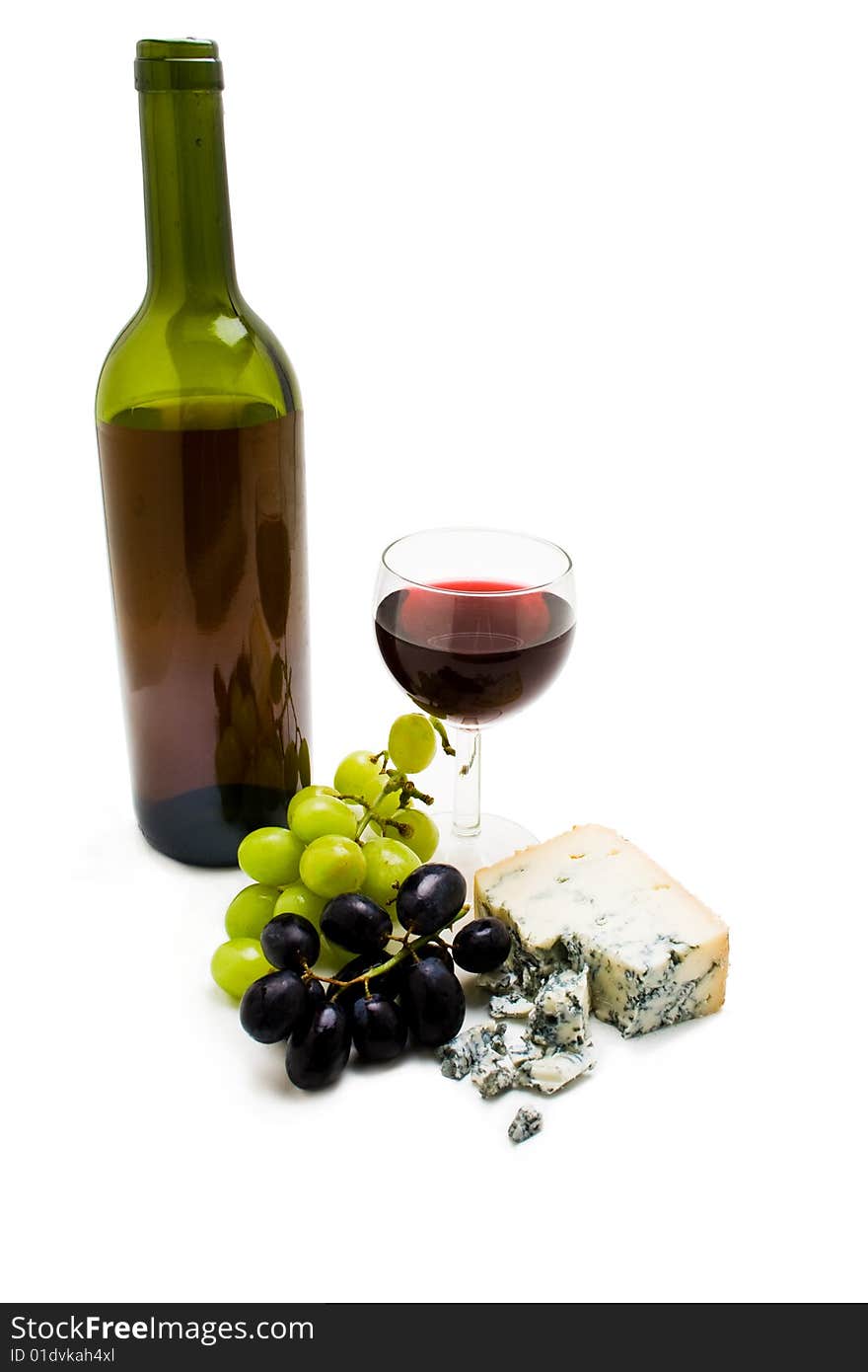 Wine bottle with cheese and grapes