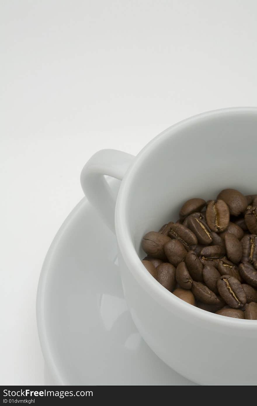 Crop image of coffee bean in ceramic cup. Crop image of coffee bean in ceramic cup