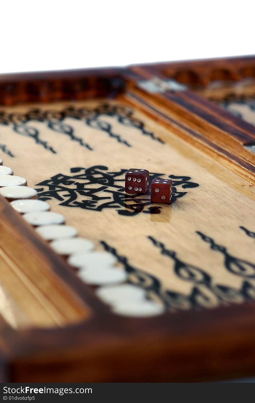 Isolated Wooden handmade backgammon board with two dices