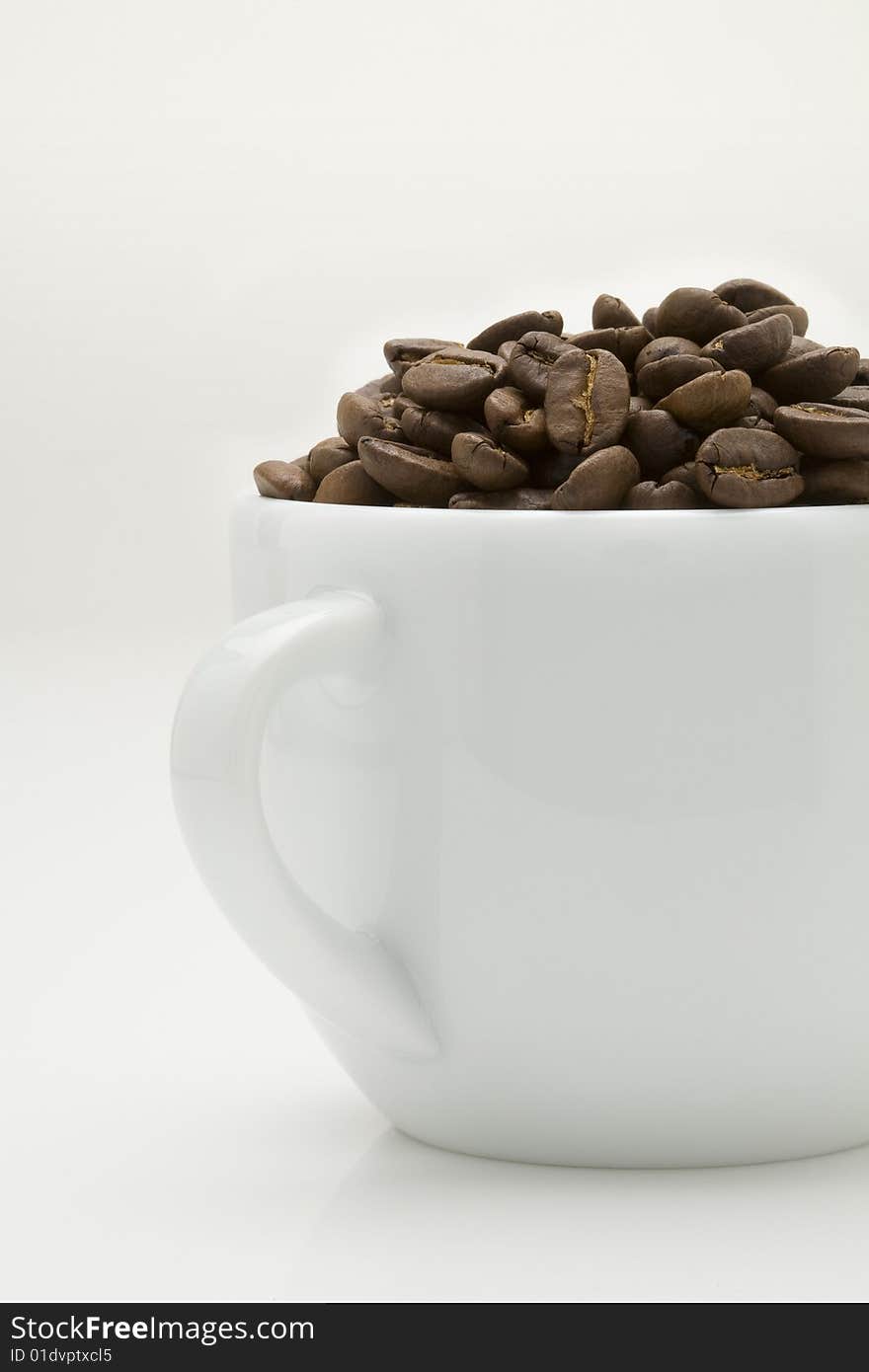 Crop image of coffee bean in ceramic cup. Crop image of coffee bean in ceramic cup